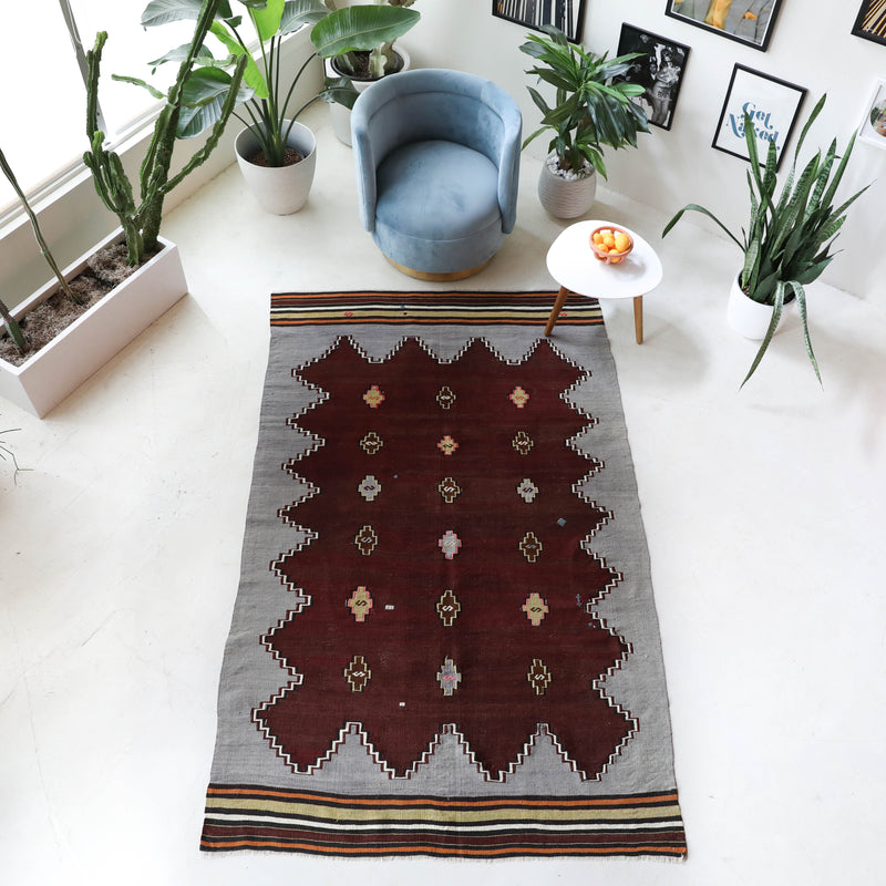 Vintage kilim rug in living room setting, bright colors, wild shaman, soft rug, bold color, Portland, Oregon, rug store, rug shop, local shop, vintage rug, modern kilim, warm colors