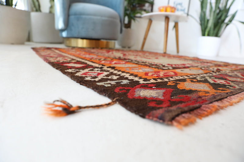 Vintage kilim rug in living room setting, old rug, antique rug, pastel colors, faded colors, Turkish rug, vintage rug, soft rug, Portland, Oregon, rug store, rug shop, local shop, earthy tones, earthy colors, warm colors