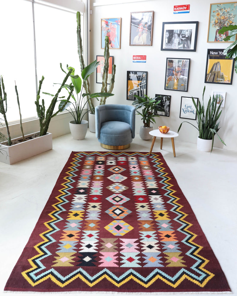 Vintage kilim rug in room decor setting, old rug, antique rug, pastel colors, faded colors, Turkish rug, vintage rug, soft rug, Portland, Oregon, rug store, rug shop, local shop, bold colors, bright colors, faded colors