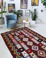 Vintage kilim rug in room decor setting, old rug, antique rug, pastel colors, faded colors, Turkish rug, vintage rug, soft rug, Portland, Oregon, rug store, rug shop, local shop, bold colors, bright colors, faded colors