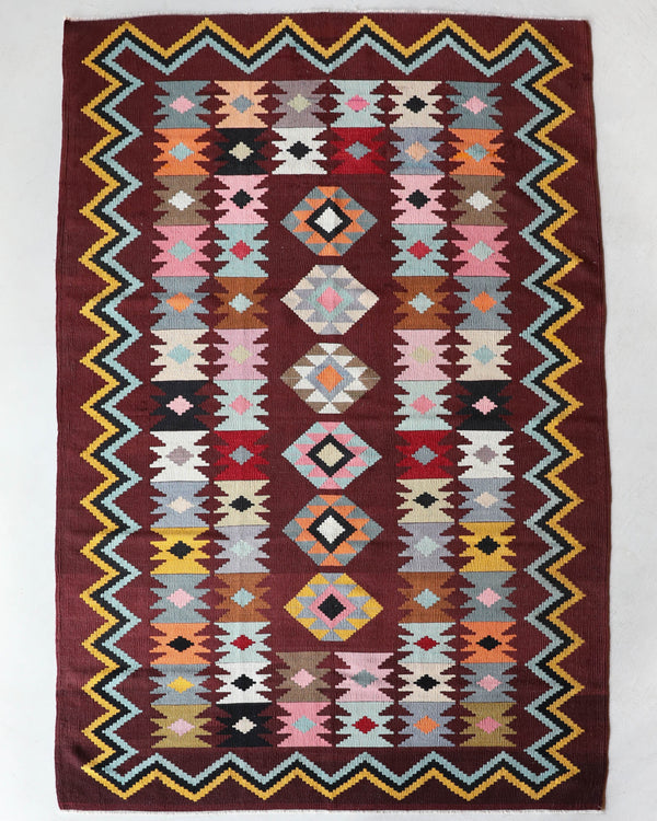 Vintage kilim rug in room decor setting, old rug, antique rug, pastel colors, faded colors, Turkish rug, vintage rug, soft rug, Portland, Oregon, rug store, rug shop, local shop, bold colors, bright colors, faded colors