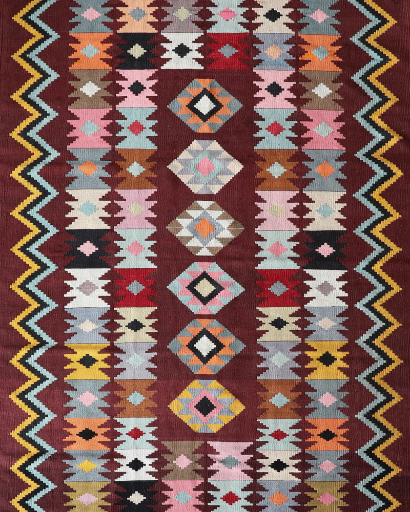 Vintage kilim rug in room decor setting, old rug, antique rug, pastel colors, faded colors, Turkish rug, vintage rug, soft rug, Portland, Oregon, rug store, rug shop, local shop, bold colors, bright colors, faded colors