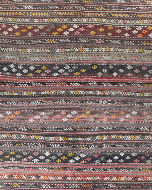 Vintage kilim rug in living room setting, old rug, antique rug, pastel colors, faded colors, Turkish rug, vintage rug, soft rug, Portland, Oregon, rug store, rug shop, local shop, earthy tones, earthy colors, warm colors