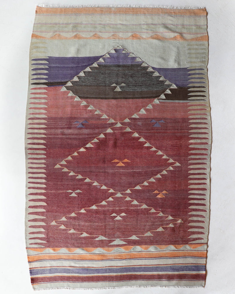 Vintage kilim rug in room decor setting, old rug, antique rug, pastel colors, faded colors, Turkish rug, vintage rug, soft rug, Portland, Oregon, rug store, rug shop, local shop, bold colors, bright colors, faded colors