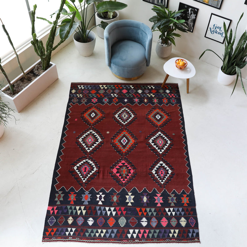 Vintage kilim rug in room decor setting, old rug, antique rug, pastel colors, faded colors, Turkish rug, vintage rug, soft rug, Portland, Oregon, rug store, rug shop, local shop, bold colors, bright colors