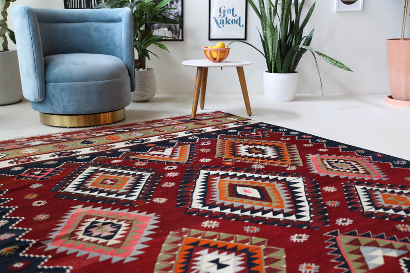 Vintage kilim rug in room decor setting, old rug, antique rug, pastel colors, faded colors, Turkish rug, vintage rug, soft rug, Portland, Oregon, rug store, rug shop, local shop, bold colors, bright colors