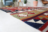 Vintage kilim rug in room decor setting, old rug, antique rug, pastel colors, faded colors, Turkish rug, vintage rug, soft rug, Portland, Oregon, rug store, rug shop, local shop, bold colors, bright colors