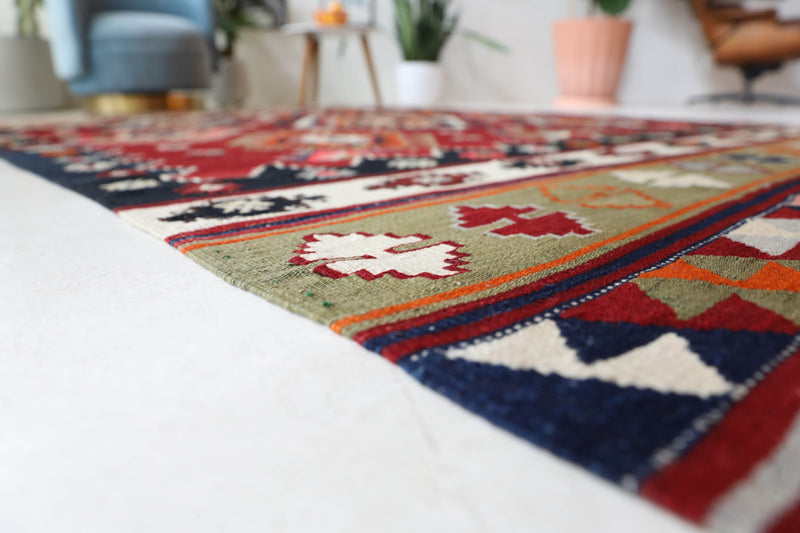 Vintage kilim rug in room decor setting, old rug, antique rug, pastel colors, faded colors, Turkish rug, vintage rug, soft rug, Portland, Oregon, rug store, rug shop, local shop, bold colors, bright colors