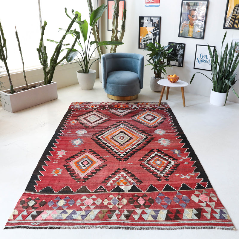 Vintage kilim rug in living room setting, bright colors, wild shaman, soft rug, bold color, Portland, Oregon, rug store, rug shop, local shop, vintage rug, modern kilim, warm colors