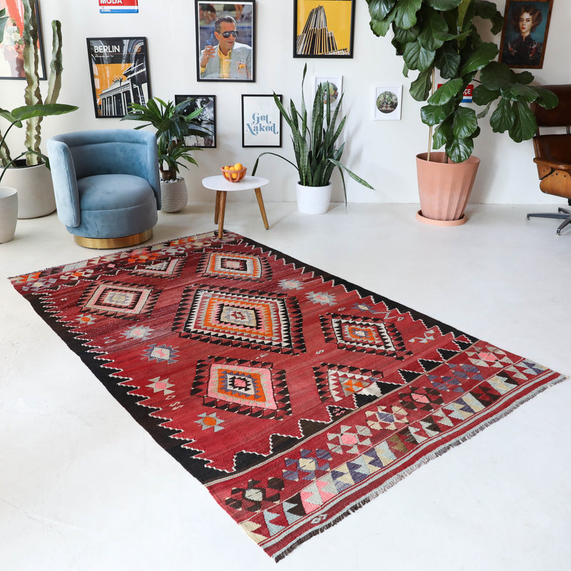 Vintage kilim rug in living room setting, bright colors, wild shaman, soft rug, bold color, Portland, Oregon, rug store, rug shop, local shop, vintage rug, modern kilim, warm colors