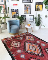 Vintage kilim rug in living room setting, bright colors, wild shaman, soft rug, bold color, Portland, Oregon, rug store, rug shop, local shop, vintage rug, modern kilim, warm colors