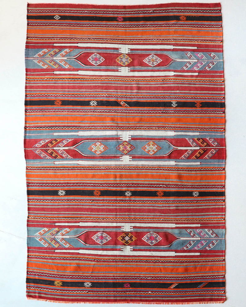 Vintage kilim rug in room decor setting, old rug, antique rug, pastel colors, faded colors, Turkish rug, vintage rug, soft rug, Portland, Oregon, rug store, rug shop, local shop, bold colors, bright colors,