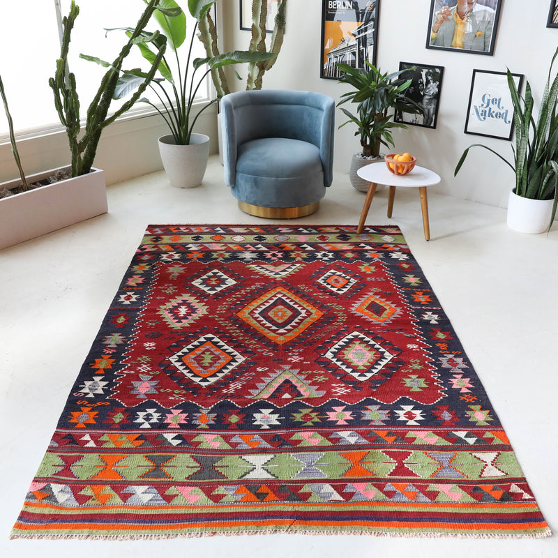 Vintage kilim rug in living room setting, bright colors, wild shaman, soft rug, bold color, Portland, Oregon, rug store, rug shop, local shop, vintage rug, modern kilim, warm colors