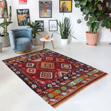 Vintage kilim rug in living room setting, bright colors, wild shaman, soft rug, bold color, Portland, Oregon, rug store, rug shop, local shop, vintage rug, modern kilim, warm colorsVintage kilim rug in living room setting, bright colors, wild shaman, soft rug, bold color, Portland, Oregon, rug store, rug shop, local shop, vintage rug, modern kilim, warm colors