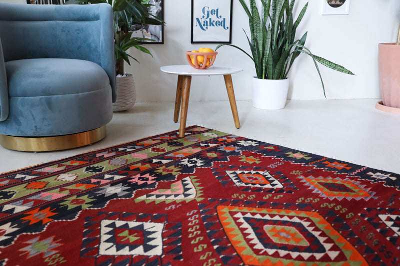 Vintage kilim rug in living room setting, bright colors, wild shaman, soft rug, bold color, Portland, Oregon, rug store, rug shop, local shop, vintage rug, modern kilim, warm colors