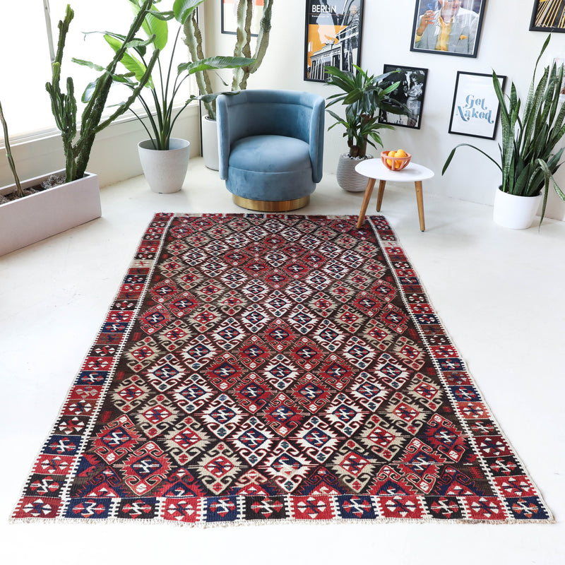 Vintage kilim rug in living room setting, bright colors, wild shaman, soft rug, bold color, Portland, Oregon, rug store, rug shop, local shop, vintage rug, modern kilim, warm colors