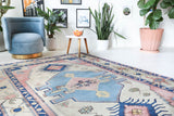 Vintage Turkish rug in living room setting, old rug, antique rug, pastel colors, faded colors, Turkish rug, vintage rug, soft rug, Portland, Oregon, rug store, rug shop, local shop