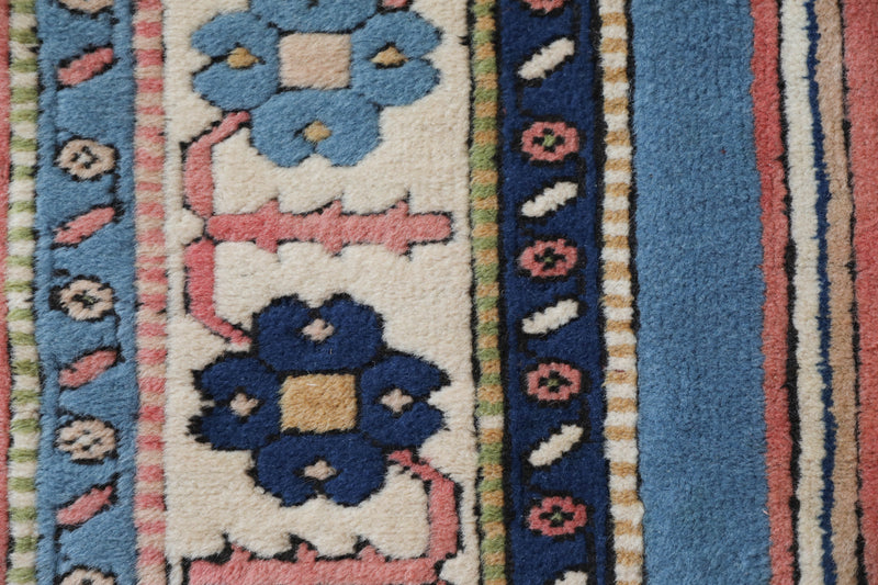 Vintage Turkish rug in living room setting, old rug, antique rug, pastel colors, faded colors, Turkish rug, vintage rug, soft rug, Portland, Oregon, rug store, rug shop, local shop