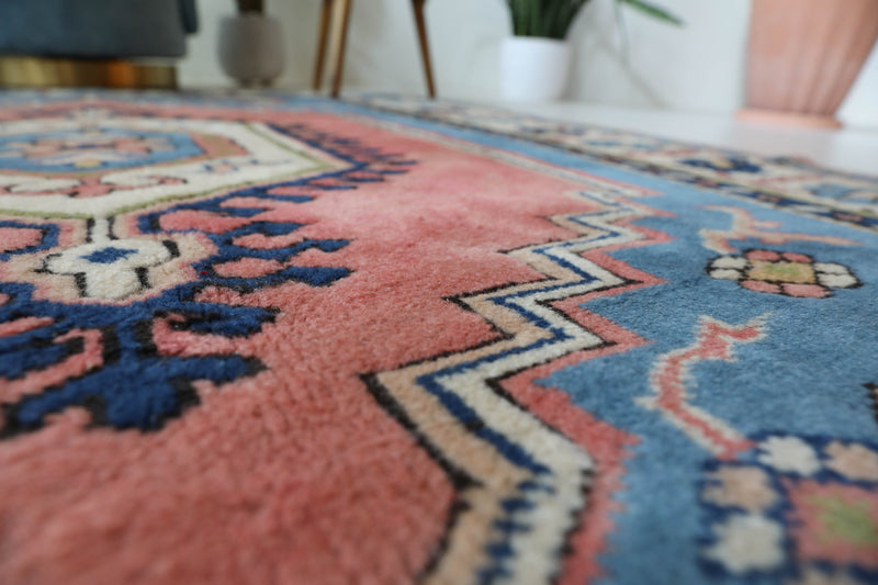 Vintage Turkish rug in living room setting, old rug, antique rug, pastel colors, faded colors, Turkish rug, vintage rug, soft rug, Portland, Oregon, rug store, rug shop, local shop