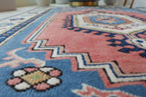 Vintage Turkish rug in living room setting, old rug, antique rug, pastel colors, faded colors, Turkish rug, vintage rug, soft rug, Portland, Oregon, rug store, rug shop, local shop