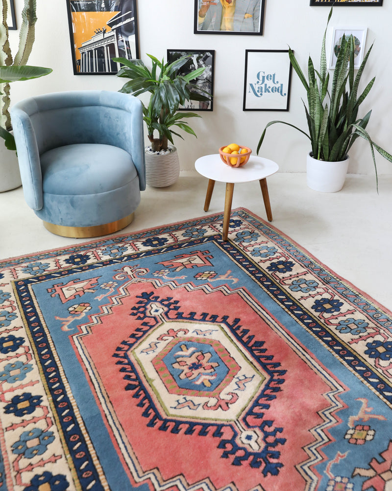 Vintage Turkish rug in living room setting, old rug, antique rug, pastel colors, faded colors, Turkish rug, vintage rug, soft rug, Portland, Oregon, rug store, rug shop, local shop