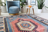 Vintage Turkish rug in living room setting, old rug, antique rug, pastel colors, faded colors, Turkish rug, vintage rug, soft rug, Portland, Oregon, rug store, rug shop, local shop