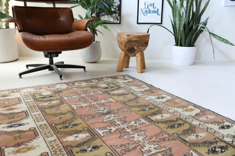 Vintage Turkish rug in living room setting, old rug, antique rug, pastel colors, faded colors, Turkish rug, vintage rug, soft rug, Portland, Oregon, rug store, rug shop, local shop