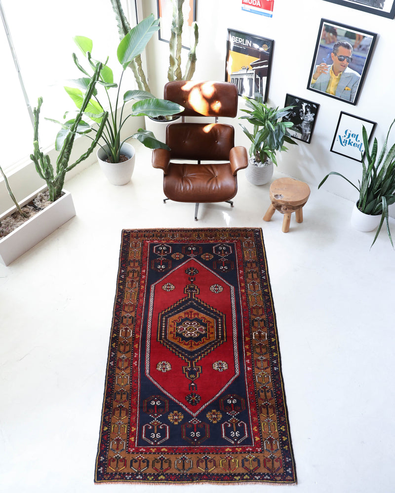 Vintage Turkish rug in a living room setting, pile rug, Turkish rug, vintage rug, portland, rug shop, bright colors, wild shaman, soft rug, bold color, Portland, Oregon, rug store, rug shop, local shop, antique rug