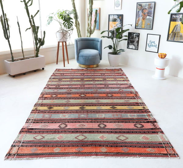  Vintage kilim rug in room decor setting, old rug, antique rug, pastel colors, faded colors, Turkish rug, vintage rug, soft rug, Portland, Oregon, rug store, rug shop, local shop, bold colors, bright colors, faded colors