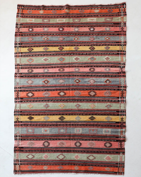  Vintage kilim rug in room decor setting, old rug, antique rug, pastel colors, faded colors, Turkish rug, vintage rug, soft rug, Portland, Oregon, rug store, rug shop, local shop, bold colors, bright colors, faded colors