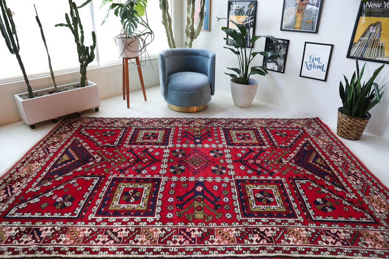 Vintage Turkish rug in a living room setting, pile rug, Turkish rug, vintage rug, portland, rug shop, bright colors, wild shaman, soft rug, bold color, Portland, Oregon, rug store, rug shop, local shop, antique rug