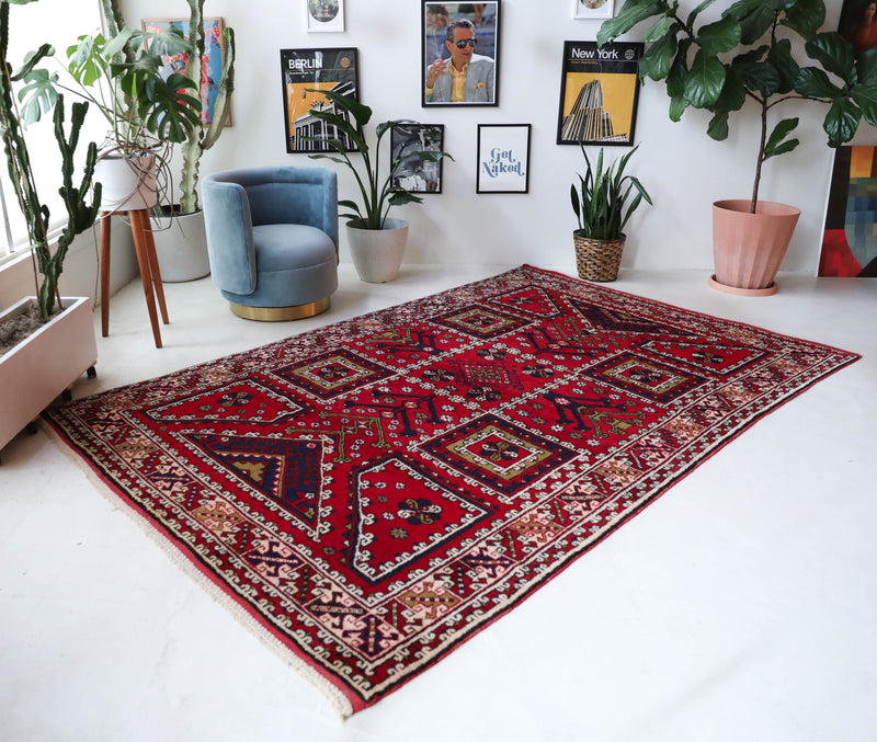 Vintage Turkish rug in a living room setting, pile rug, Turkish rug, vintage rug, portland, rug shop, bright colors, wild shaman, soft rug, bold color, Portland, Oregon, rug store, rug shop, local shop, antique rug