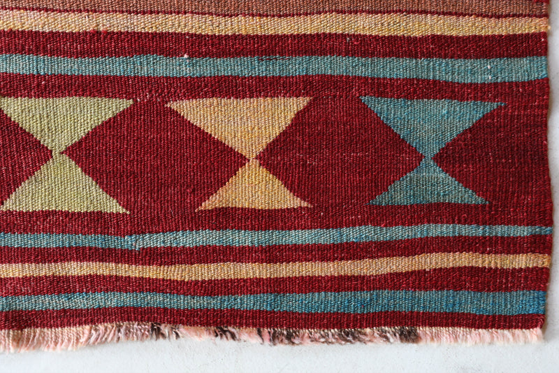 Vintage kilim rug in living room setting, bright colors, wild shaman, soft rug, bold color, Portland, Oregon, rug store, rug shop, local shop, vintage rug, modern kilim, warm colors