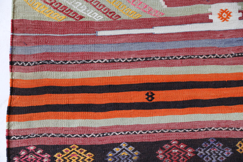 Vintage kilim rug in living room setting, bright colors, wild shaman, soft rug, bold color, Portland, Oregon, rug store, rug shop, local shop, vintage rug, modern kilim, warm colors