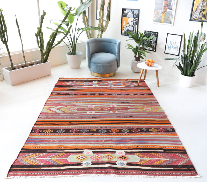 Vintage kilim rug in living room setting, bright colors, wild shaman, soft rug, bold color, Portland, Oregon, rug store, rug shop, local shop, vintage rug, modern kilim, warm colors