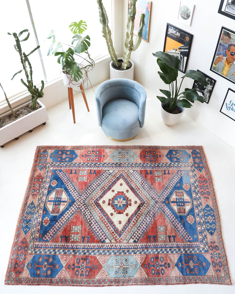 Vintage Turkish rug in living room setting, old rug, antique rug, pastel colors, faded colors, Turkish rug, vintage rug, soft rug, Portland, Oregon, rug store, rug shop, local shop