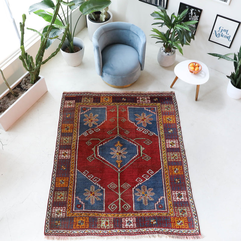 Vintage Turkish rug in a living room setting, Area rug in a living room setting, pile rug, Turkish rug, custom rug, modern rug, portland, rug shop, bright colors, wild shaman, soft rug, bold color, Portland, Oregon, rug store, rug shop, local shop