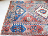 Vintage Turkish rug in living room setting, old rug, antique rug, pastel colors, faded colors, Turkish rug, vintage rug, soft rug, Portland, Oregon, rug store, rug shop, local shop