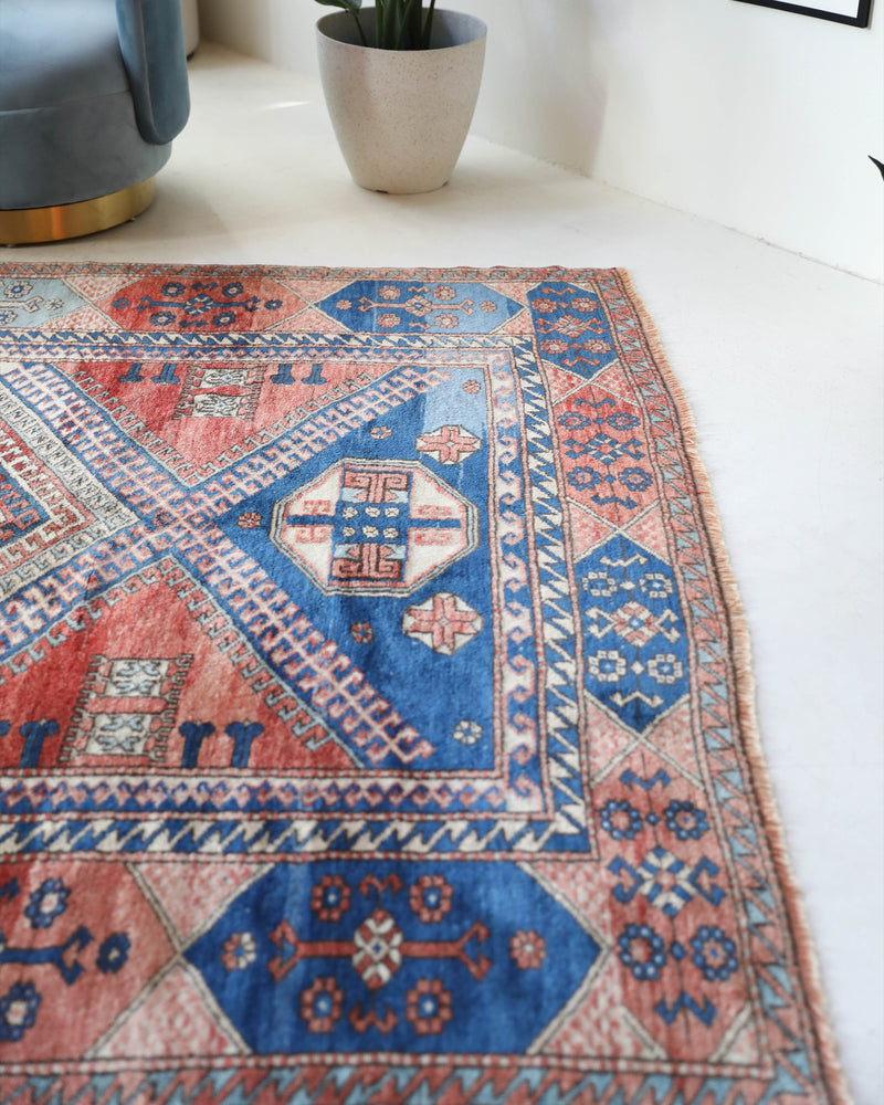 Vintage Turkish rug in living room setting, old rug, antique rug, pastel colors, faded colors, Turkish rug, vintage rug, soft rug, Portland, Oregon, rug store, rug shop, local shop