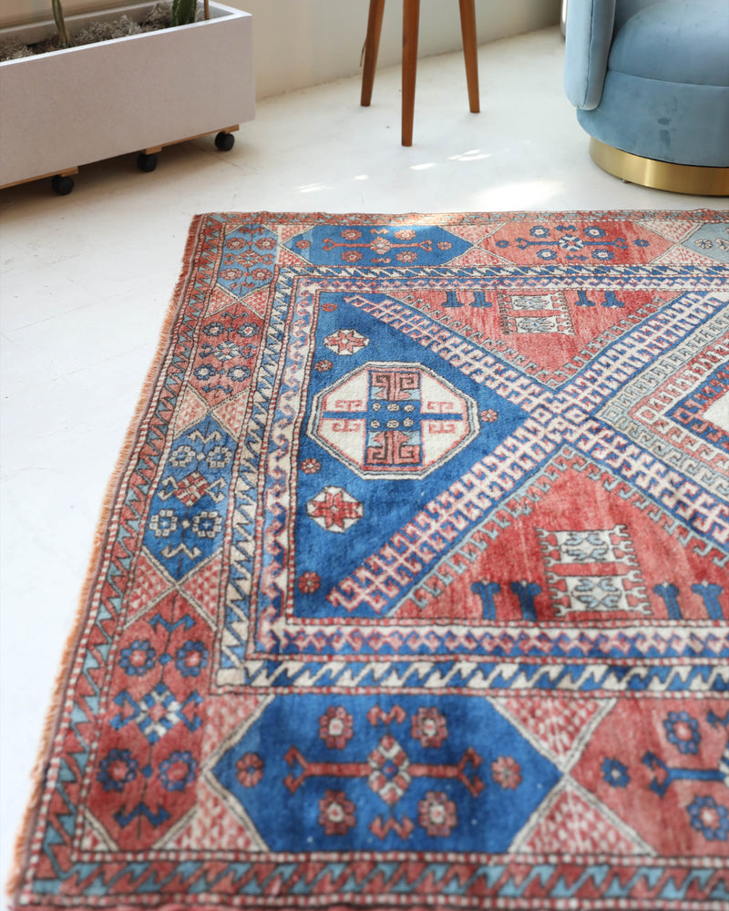 Vintage Turkish rug in living room setting, old rug, antique rug, pastel colors, faded colors, Turkish rug, vintage rug, soft rug, Portland, Oregon, rug store, rug shop, local shop