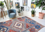 Vintage Turkish rug in living room setting, old rug, antique rug, pastel colors, faded colors, Turkish rug, vintage rug, soft rug, Portland, Oregon, rug store, rug shop, local shop