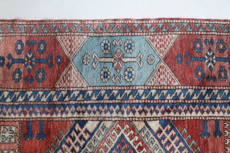 Vintage Turkish rug in living room setting, old rug, antique rug, pastel colors, faded colors, Turkish rug, vintage rug, soft rug, Portland, Oregon, rug store, rug shop, local shop