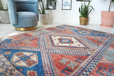 Vintage Turkish rug in living room setting, old rug, antique rug, pastel colors, faded colors, Turkish rug, vintage rug, soft rug, Portland, Oregon, rug store, rug shop, local shop