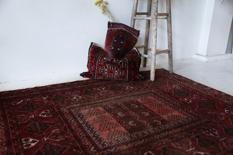 Antique Turkmen rug in a living room setting, pile rug, Turkish rug, vintage rug, portland, rug shop, bright colors, wild shaman, soft rug, bold color, Portland, Oregon, rug store, rug shop, local shop, antique rug