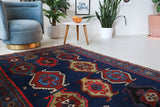 Vintage Turkish rug in a living room setting, Area rug in a living room setting, pile rug, Turkish rug, custom rug, modern rug, portland, rug shop, bright colors, wild shaman, soft rug, bold color, Portland, Oregon, rug store, rug shop, local shop