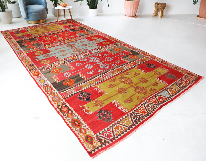 Vintage kilim rug in living room setting, bright colors, wild shaman, soft rug, bold color, Portland, Oregon, rug store, rug shop, local shop, vintage rug, modern kilim, warm colors