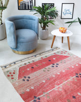 Vintage kilim rug in living room setting, old rug, antique rug, pastel colors, faded colors, Turkish rug, vintage rug, soft rug, Portland, Oregon, rug store, rug shop, local shop, earthy tones, earthy colors, warm colors