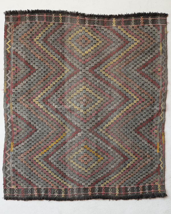 Vintage kilim rug in living room setting, old rug, antique rug, pastel colors, faded colors, Turkish rug, vintage rug, soft rug, Portland, Oregon, rug store, rug shop, local shop, earthy tones, earthy colors, warm colors