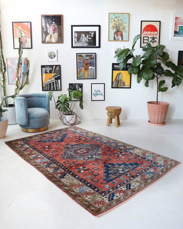 Vintage Turkish rug in living room setting, old rug, antique rug, pastel colors, faded colors, Turkish rug, vintage rug, soft rug, Portland, Oregon, rug store, rug shop, local shop