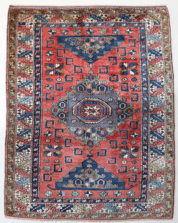 Vintage Turkish rug in living room setting, old rug, antique rug, pastel colors, faded colors, Turkish rug, vintage rug, soft rug, Portland, Oregon, rug store, rug shop, local shop